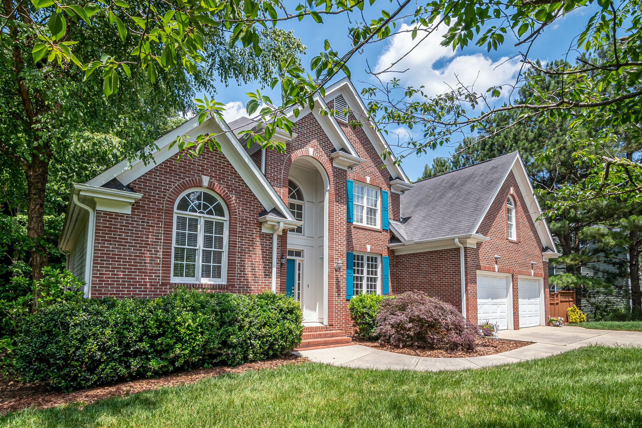 A brick home with an arched entry in Greater Cincinnati, Ohio -- confirming a home’s school district before buying, Kristine Green Realtor